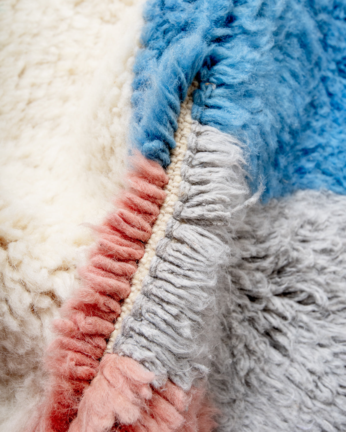 Modern, designer, handcrafted Berber rug from Morocco. Beniourain carpet with beautiful colours and patterns and fluffy wool texture.